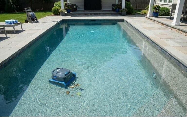 An automated pool cleaner maintaining a clear and consistently well-kept residential pool